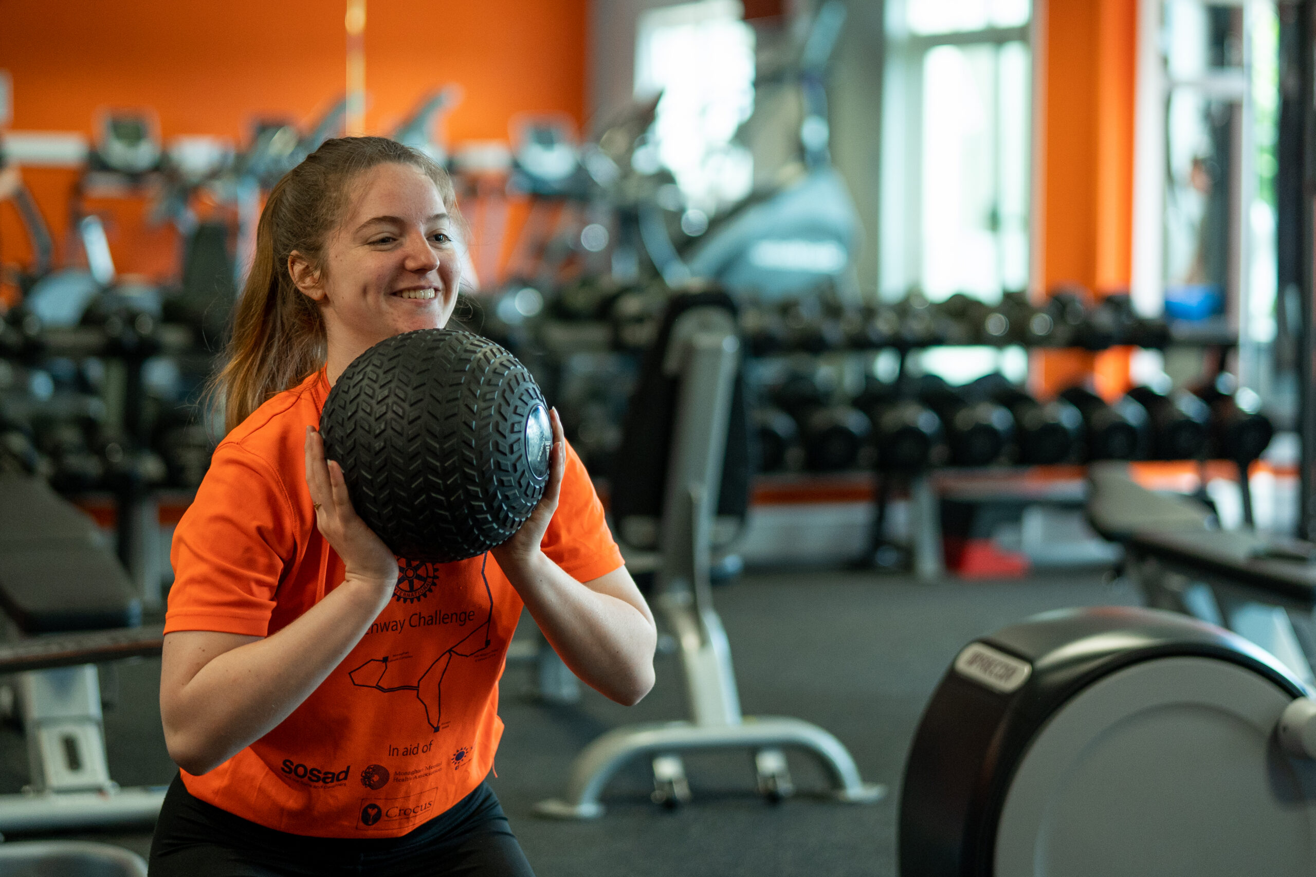 Member performing functional training exercise with a medicine ball in Hillgrove Fitness Club, Monaghan